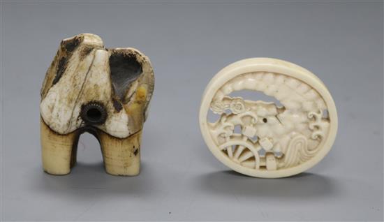 A 19th century Japanese ivory oval manju netsuke and a stag antler root netsuke, (561, 594)